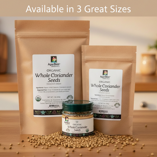Two packages of AyurBest Organic Whole Coriander Seeds and a jar of seeds on a wooden surface.