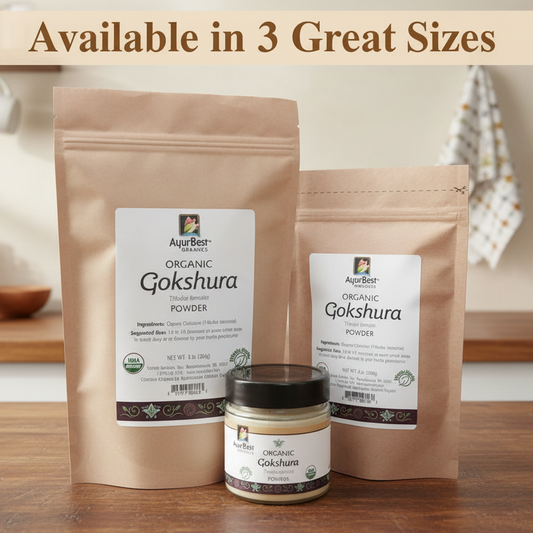 Two brown packages and a jar of AjurBest Organic Gokshura Powder on a wooden surface.