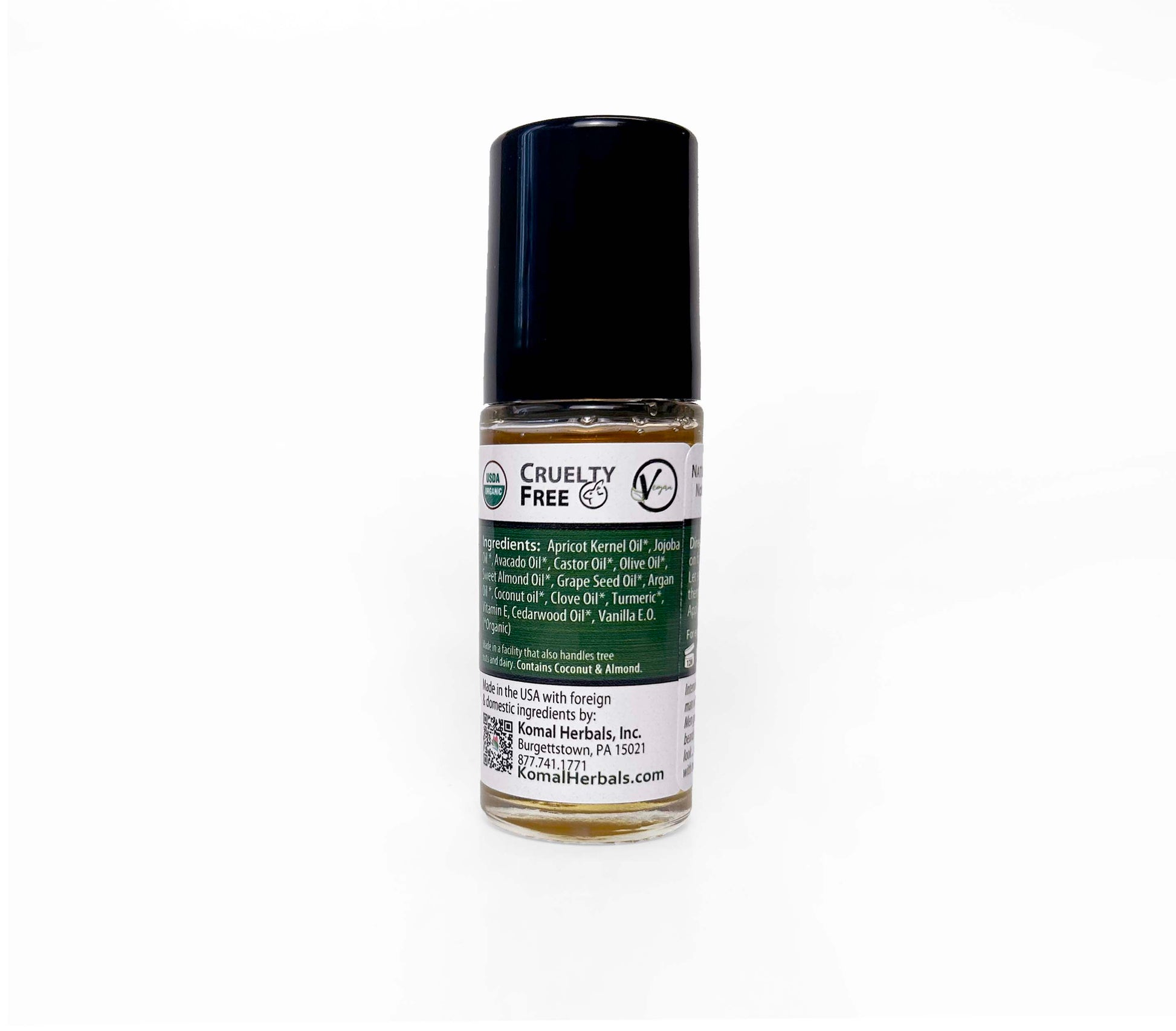 Komal Clean shave oil bottle showing ingredients Apricot kernel oil, jojoba oil, castor oil olive oil turmeric clove cedarwood vanilla