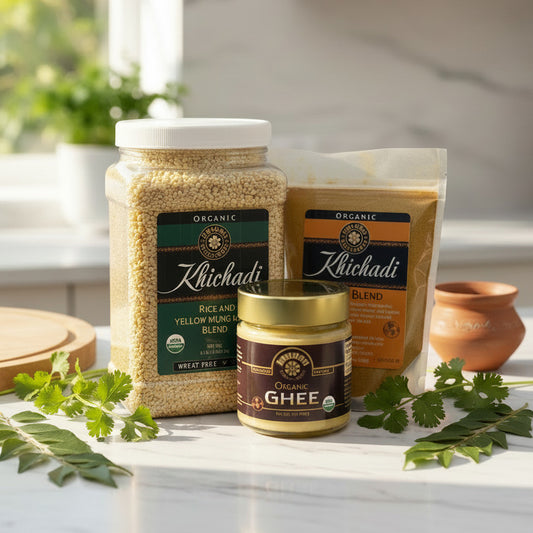 An organic khichadi spice blend bag, an organic khichadi (rice and yellow mung beans) jar, and a jar of organic ghee, all labeled and arranged in a fresh kitchen setting