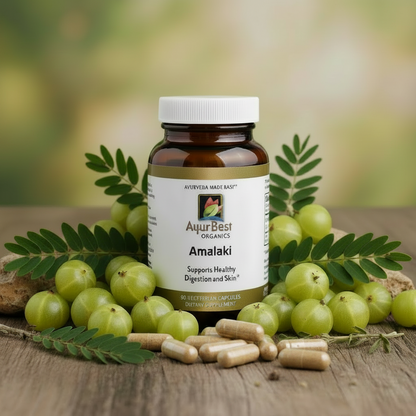 AyurBest Organics Amalaki supplement bottle with fresh amalaki fruits on a wooden surface.
