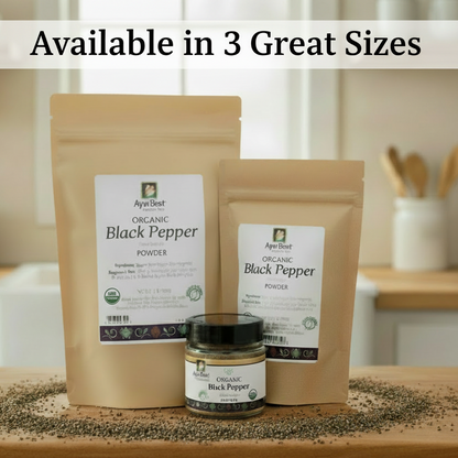 Two packages of organic black pepper and a jar with a kitchen background.