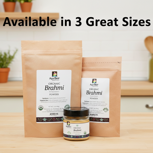 Two packages and a jar of Organic Brahmi Powder by AyurBest on a wooden surface.