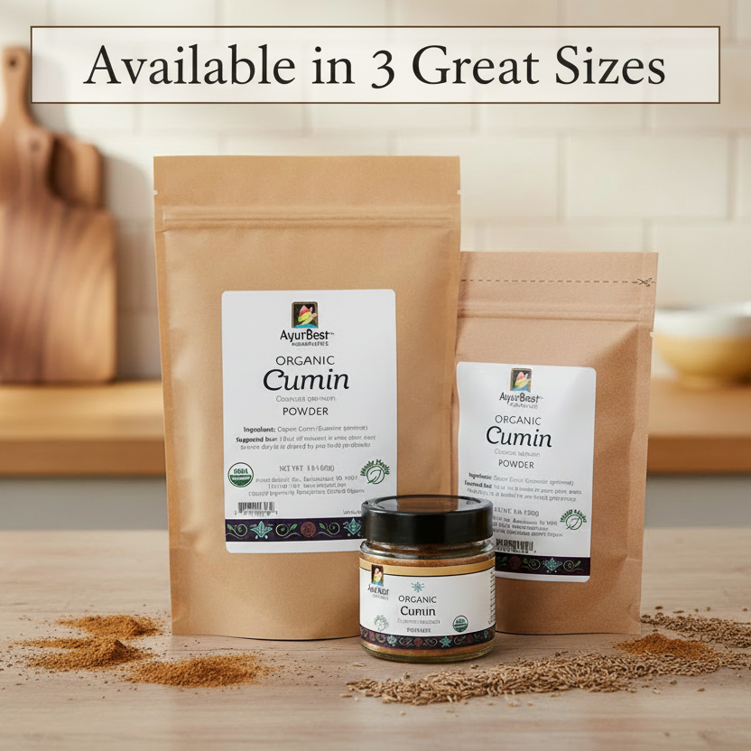 Two packages of organic cumin powder and a jar of cumin on a wooden surface with a neutral background.