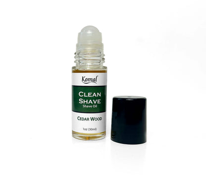 Komal Clean shave oil open bttle with rollon lid applicator and black lid