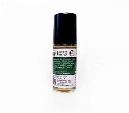 Komal Clean shave oil bottle showing ingredients Apricot kernel oil, jojoba oil, castor oil olive oil turmeric clove cedarwood vanilla