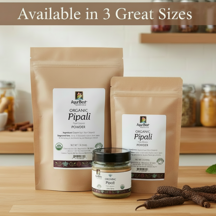 Two packages of Organic Pipali Powder on a wooden surface with jars in the background.