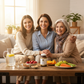 Three women sitting together with a table full of fruits, vegetables, and a bottle Shatavari supporting their hormonal health.