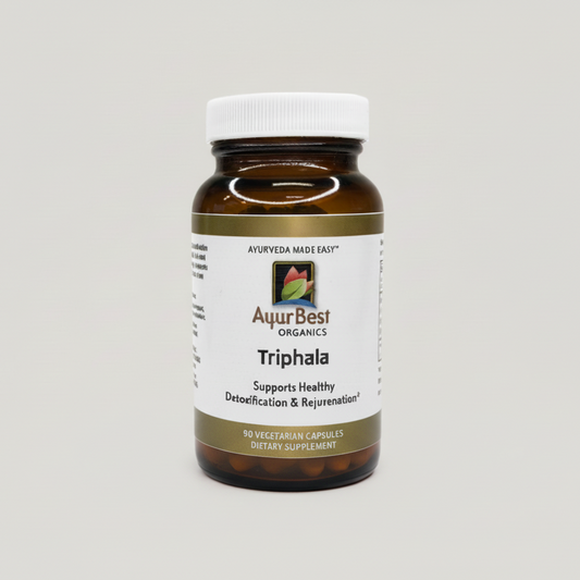 Bottle of AuurBest Organics Triphala supplement on a gray background