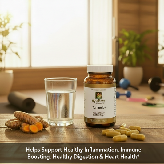 AyurBest Turmeric+ supplement bottle with capsules and a glass of water on a wooden surface. Supports Healthy Inflammation, Immune Boosting, Healthy Digestion  Heart Health text at bottom.