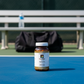 Turmeric Supplements help on and off the court to help support healthy inflammation and joint support. (court with a bench and bag in the background)