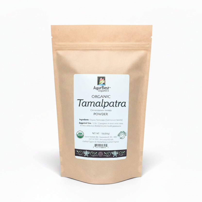 A bag of AyurBest Organic Tamalpatra Powder, with labeling that includes the product name and descriptions of its health benefits.