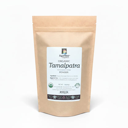A bag of AyurBest Organic Tamalpatra Powder, with labeling that includes the product name and descriptions of its health benefits.