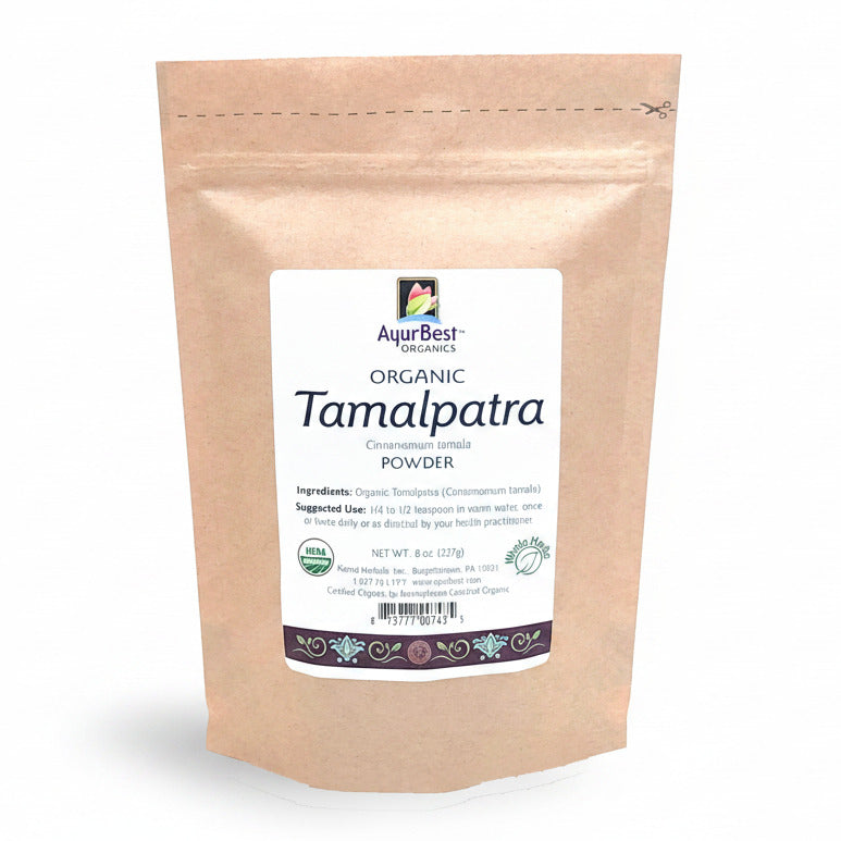 A bag of AyurBest Organic Tamalpatra Powder, with a label showing the product name and an organic certification symbol.