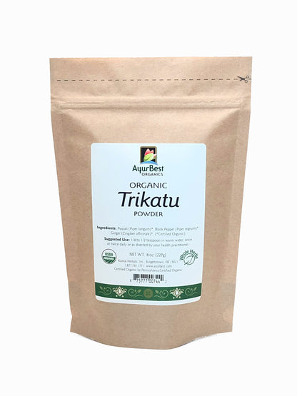 A bag of AyurBest Organic Trikatu Powder, with product information and certification logos visible.
