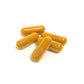 Capsules of Turmeric yellow in color on white background